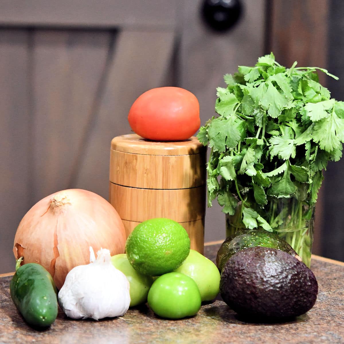 ingredients for avocado taco sauce on a countertop