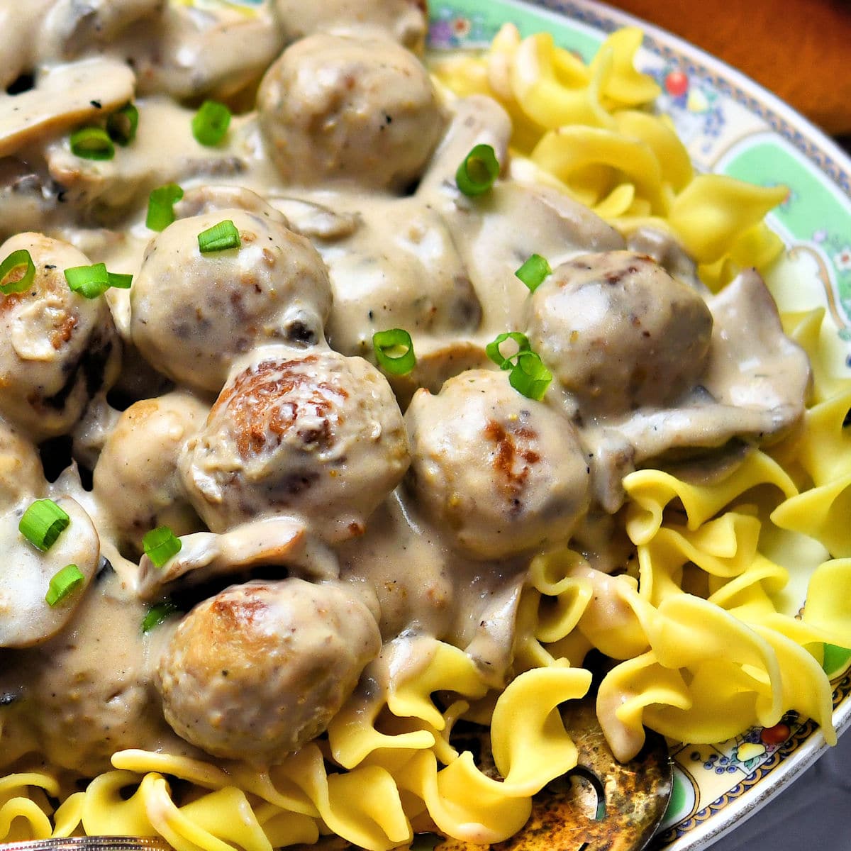 meatball stroganoff on egg noodles served on vintage oval platter