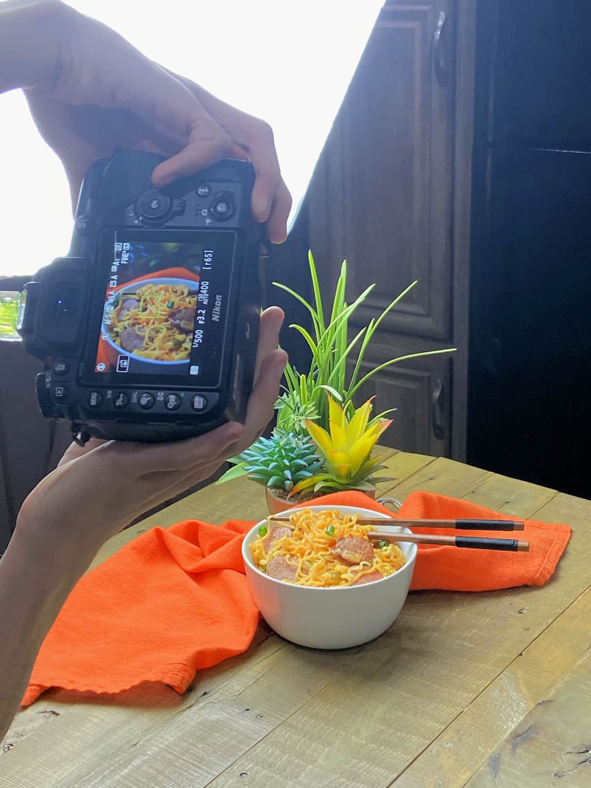 behind the scenes photo shoot for sausage ramen loaded bowl