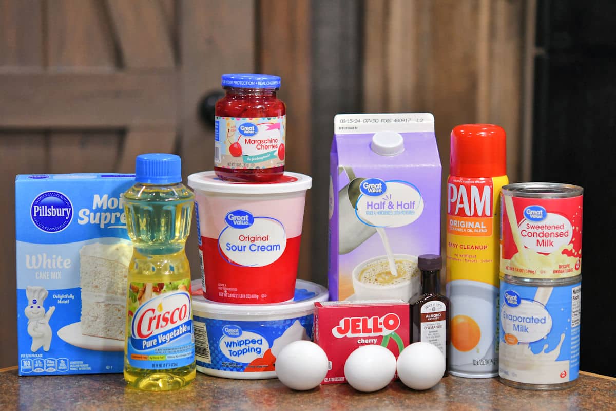 ingredients for cherry tres leches cake on a countertop