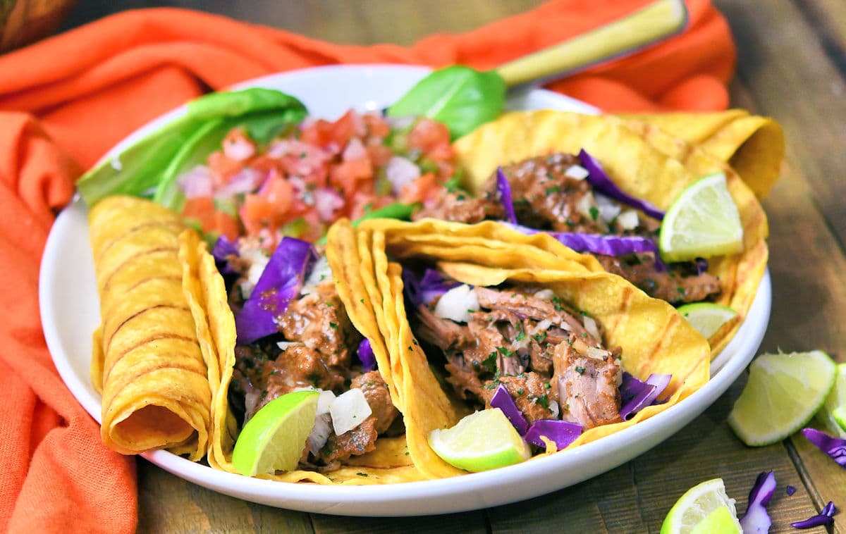 Mexican shredded beef in double corn tortillas with pico and red cabbage.