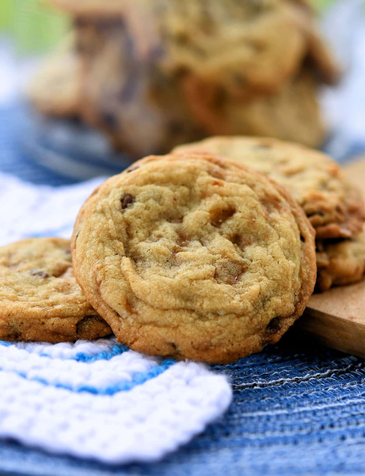 heath toffee cookies on white crochet cloth.