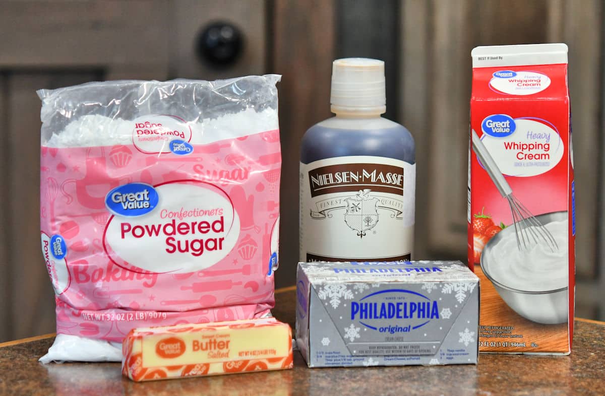 ingredients for cream cheese frosting on a countertop