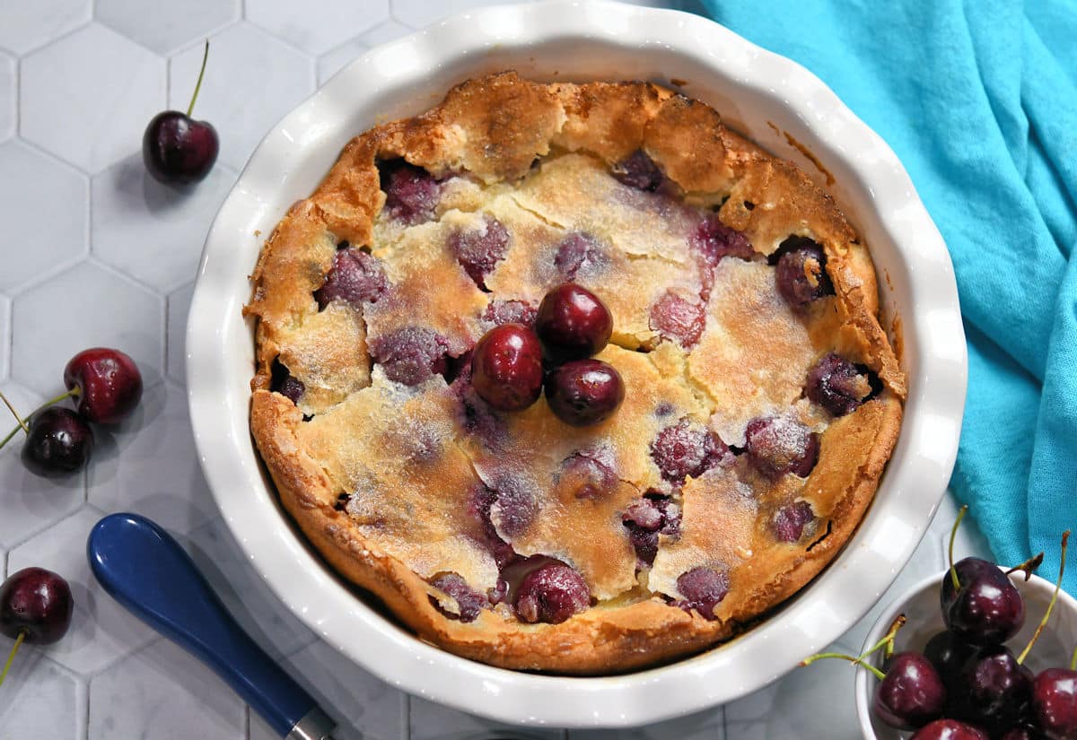 whole cherry clafoutis in a round pie pan