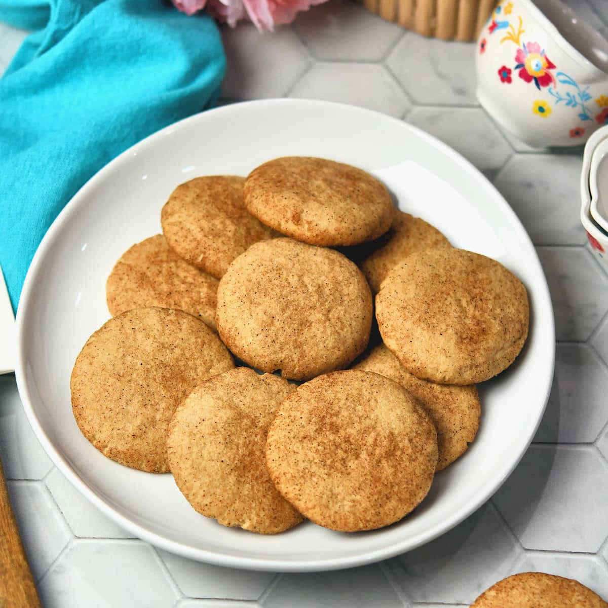 white plate of cinnamon cookies on hexagon white tile