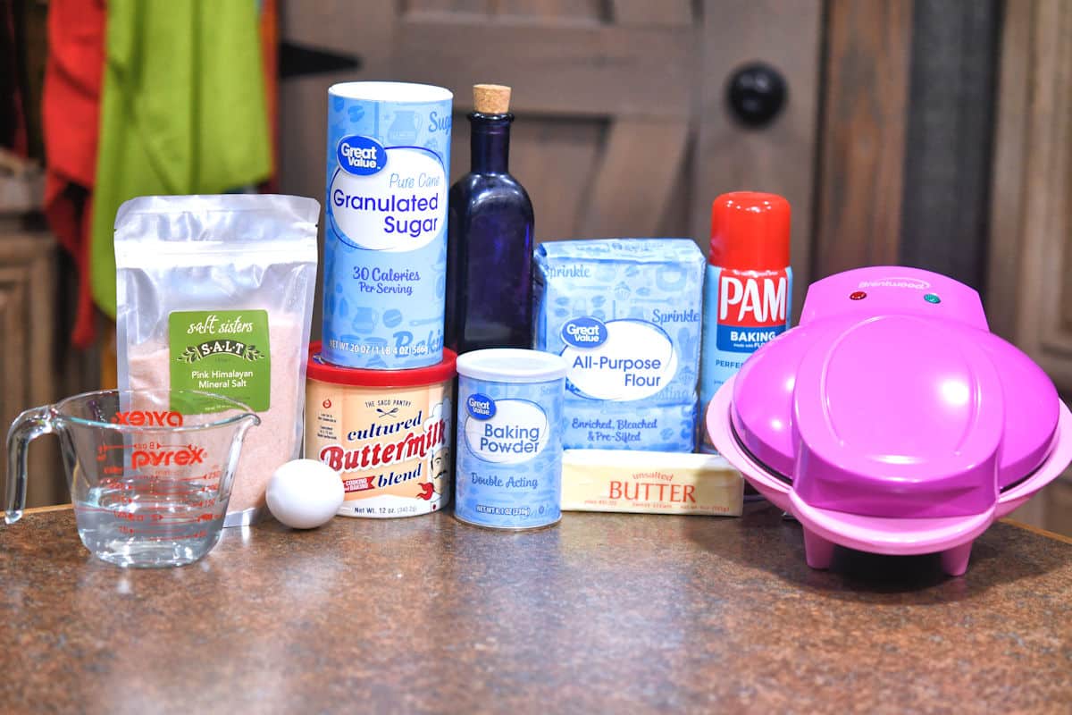 ingredients to make coconut donuts on a countertop.