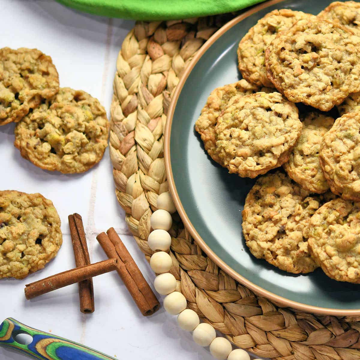 oatmeal pistachio cookies on a green ceramic plate.