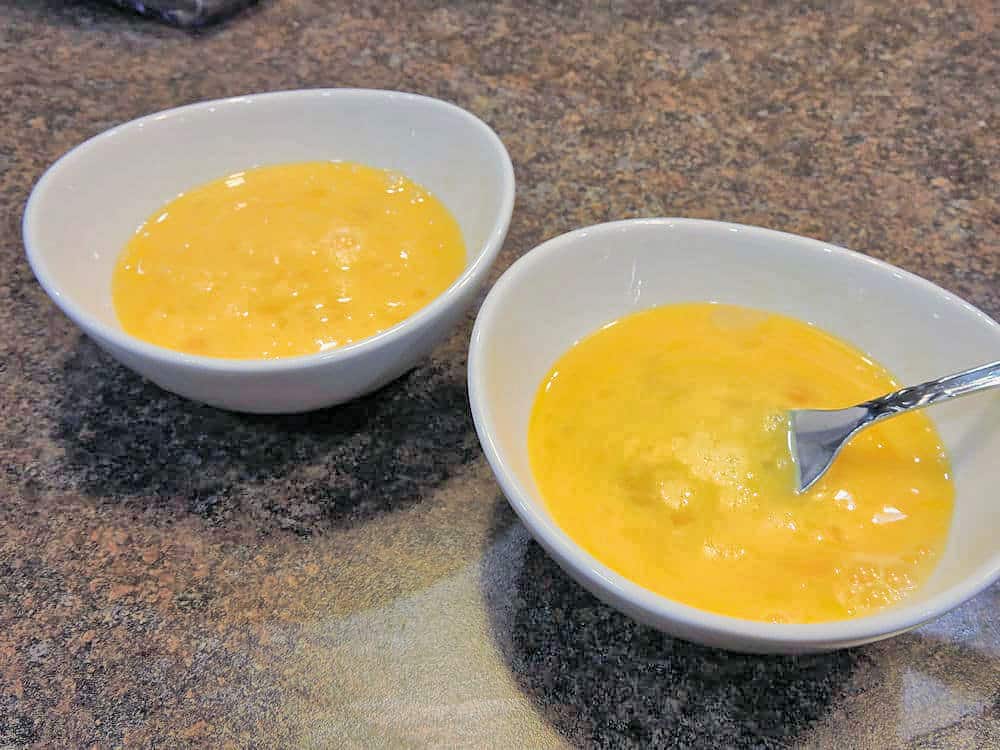 4 eggs, slightly blended with a fork in separate bowls.