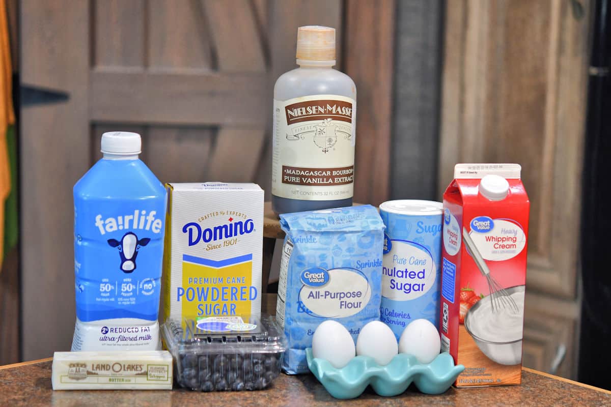 ingredients for blueberry clafoutis on a countertop