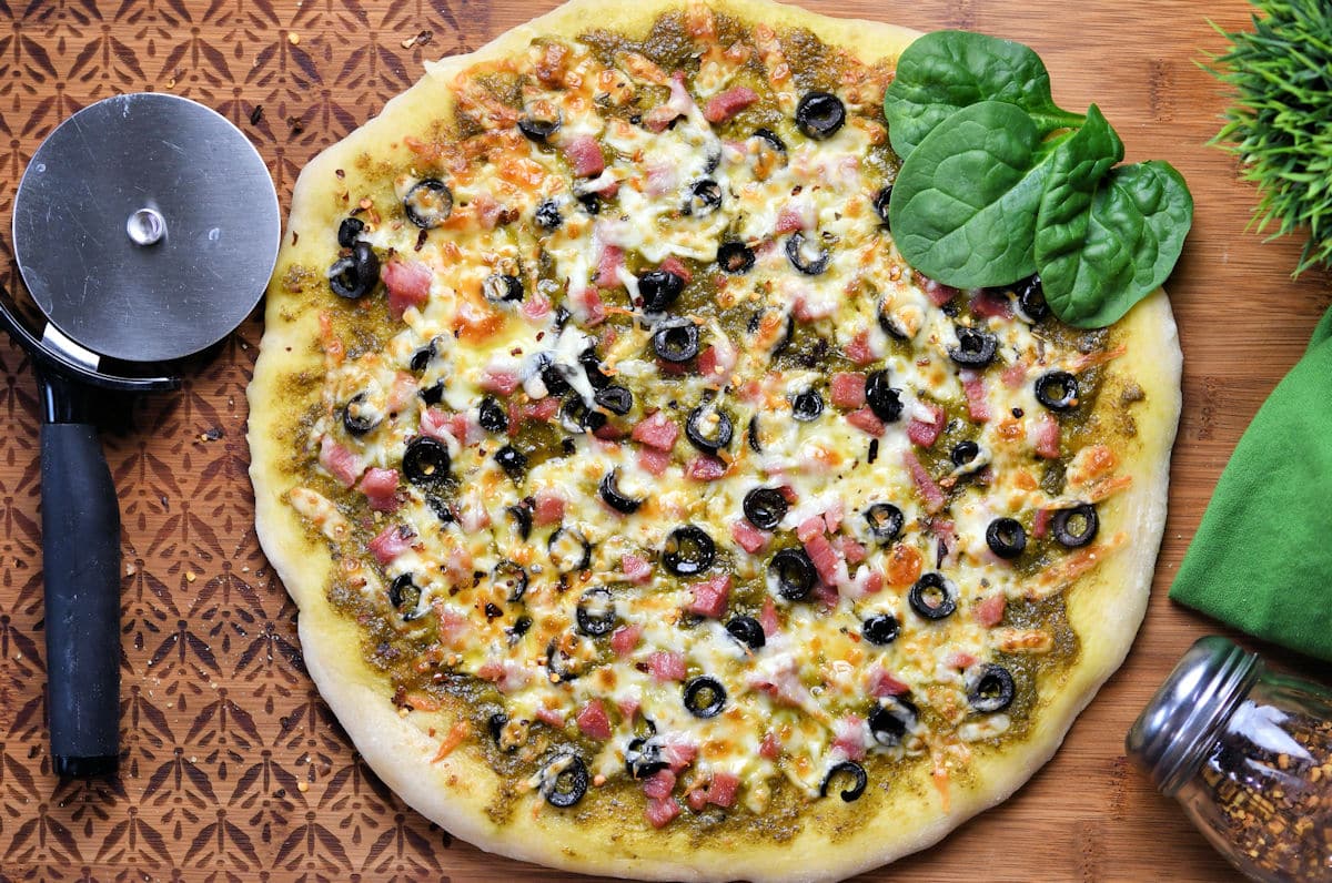 Gourmet Pesto Pizza With Ham and Black Olives, a 24Bite recipe