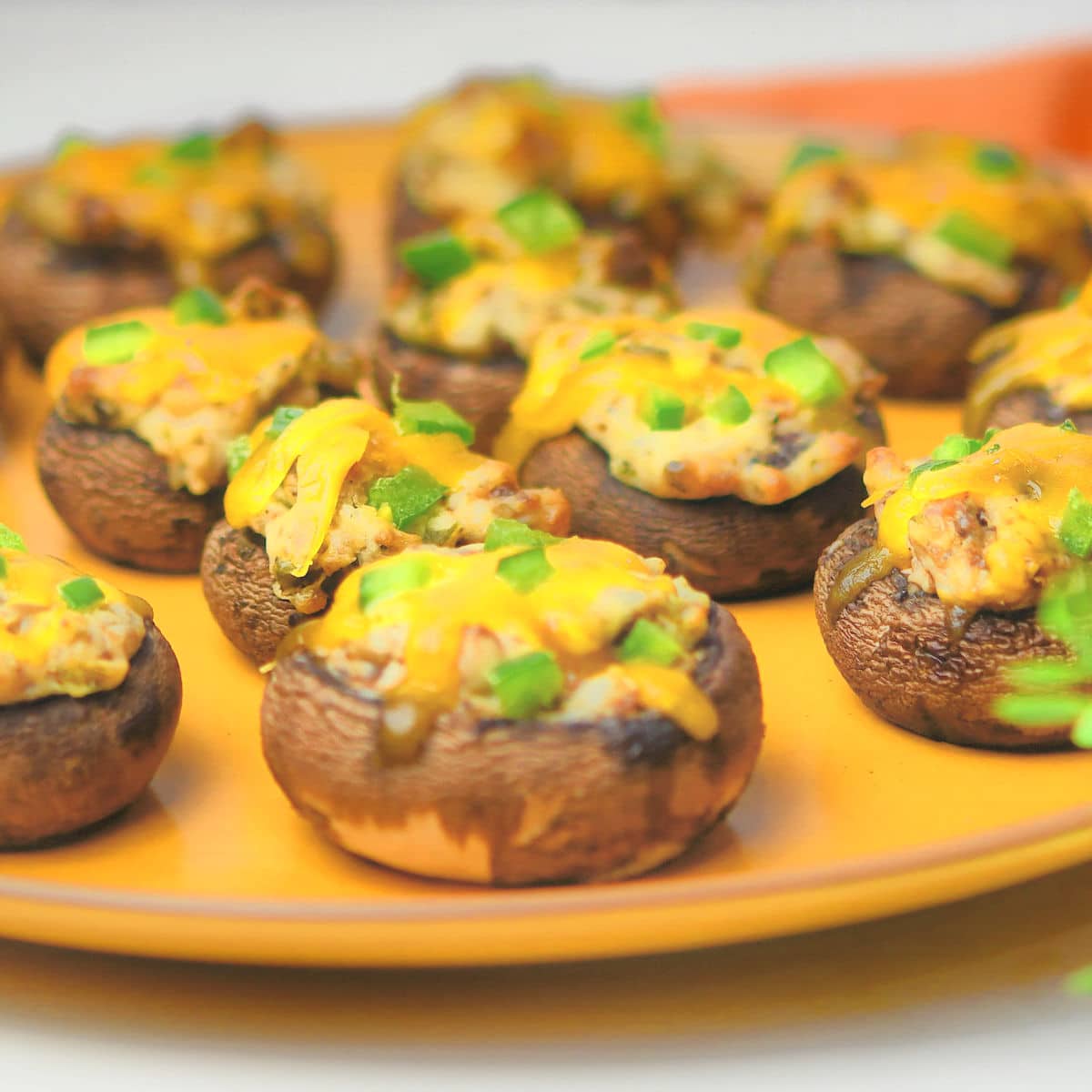 Jalapeno Popper Stuffed Mushrooms on a ceramic plate