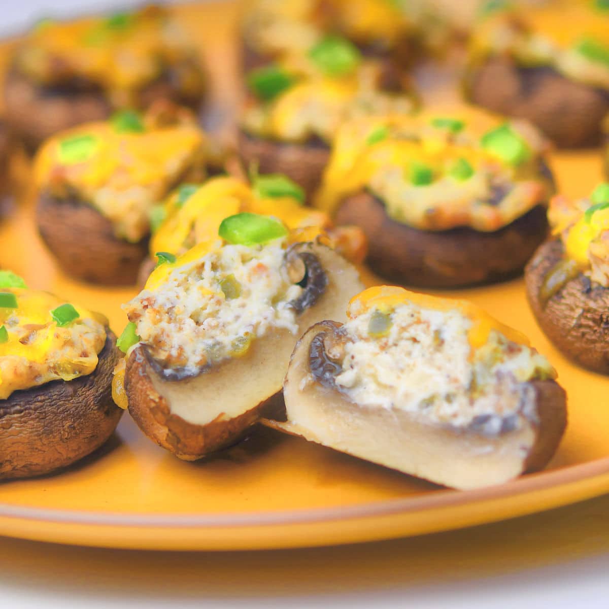 Jalapeno Popper Stuffed Mushrooms with one split in half