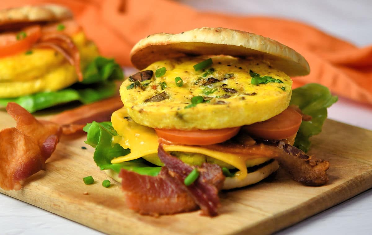 Breakfast Egg Patties sandwich on bagel thins with bacon and cheese