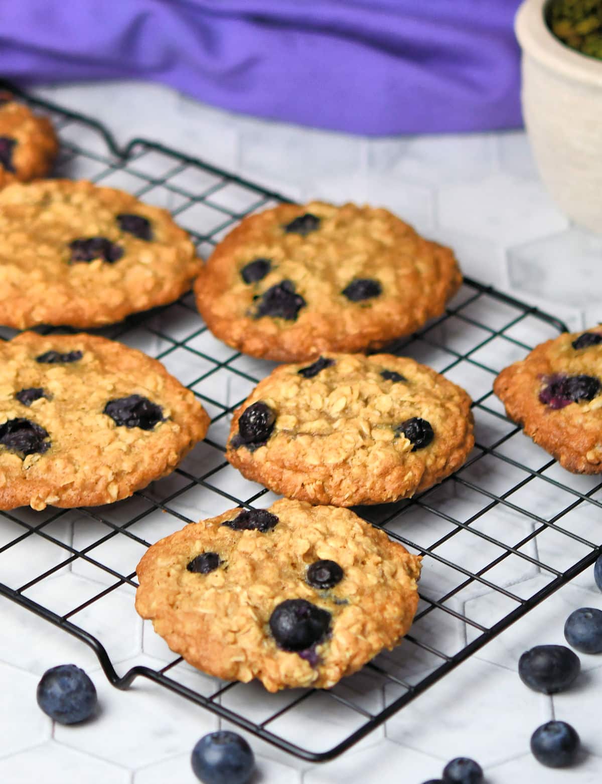 blueberry oatmeal cookies cooling on a wire rack