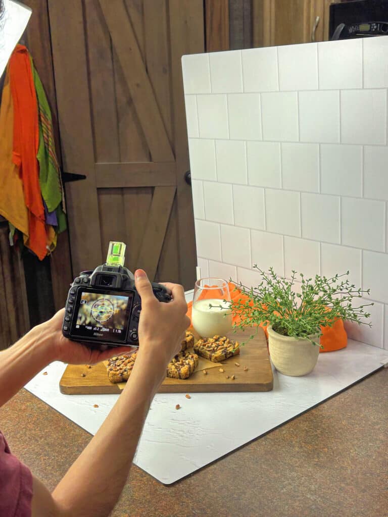 taking a photo of the photography scene and styling boards